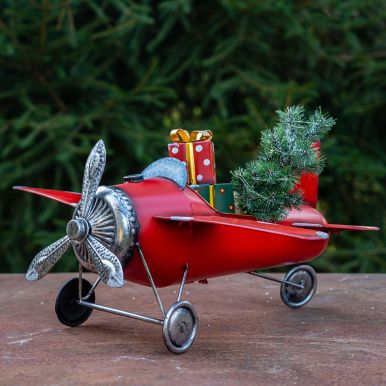 Small Red Airplane with Lighted Christmas Tree and Gifts