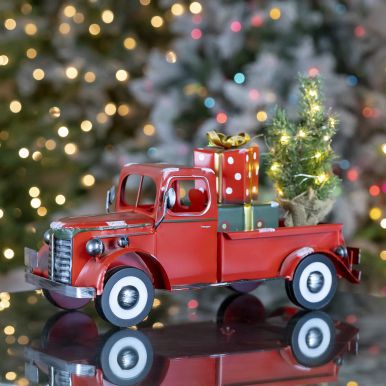 Snow Covered Pickup Truck with Lighted Christmas Tree and Gifts